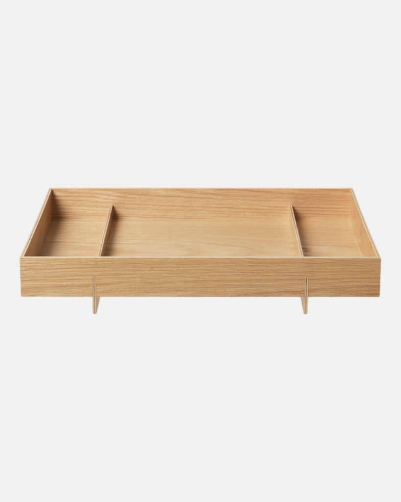 The simple and super functional ABENTO tray, by designer Adam Miller for blomus, gets its name from the traditional Asian Bento box – it is specially designed to carry a portion of home-made food, as is the custom in Japanese, Taiwanese and Korean cuisine. This design inspired the look of this simple, yet sculptural wooden tray, which is available in two sizes. It is perfect for use in the kitchen, bathroom, spa, the office – or anywhere else you might need a tray. The two feet of the ABENTO tray, which make it easy to hold, cross the body of the tray and simultaneously separate the tray area into three sections. A great helper for everyday use. The tray is also a very decorative object when it is not in use.