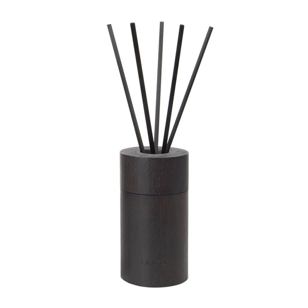 room fragrance diffuser set with the scent ‘Firewood’.
The spicy aromas, that capture us and take us on a journey, is what we remember. With a wooden note, firewood gives us a feeling of strength and warmth. We’re enclosed in a breeze of oriental and mysterious beauty.
It is not playful, but straight lined and determined, almost masculine – A scent of strength and dignity. The scented liquid is stored in a refillable glass bottle that is hidden inside the high-quality wood container. The intensity of the scent can be adjusted using the five sticks.
The beautiful hardwood container is reusable and also makes a stylish decoration. Every scent also includes a 100 ml refill, including sticks.