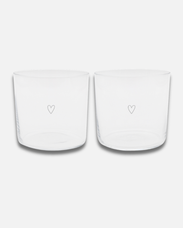 Modern Heart Print Glass Set | 350ml | Set of 2 | Stackable Design Transform your table setting with these elegant thin-walled drinking glasses. Each glass in this set of two features a delicate white heart print and unique owl base engraving. Despite their lightweight design, these 350ml glasses are surprisingly durable and conveniently stackable. Perfect for everything from water and cocktails to desserts and snacks. Dishwasher safe and sized just right at 8.5cm height, these versatile glasses blend modern style with everyday practicality.