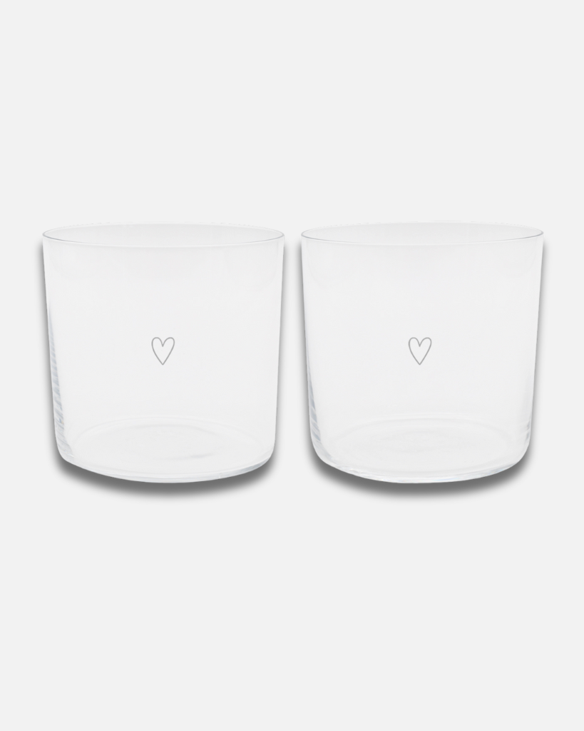 Modern Heart Print Glass Set | 350ml | Set of 2 | Stackable Design Transform your table setting with these elegant thin-walled drinking glasses. Each glass in this set of two features a delicate white heart print and unique owl base engraving. Despite their lightweight design, these 350ml glasses are surprisingly durable and conveniently stackable. Perfect for everything from water and cocktails to desserts and snacks. Dishwasher safe and sized just right at 8.5cm height, these versatile glasses blend modern style with everyday practicality.