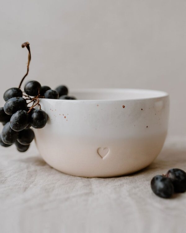 a bowl with a blind embossing in the shape of a heart.