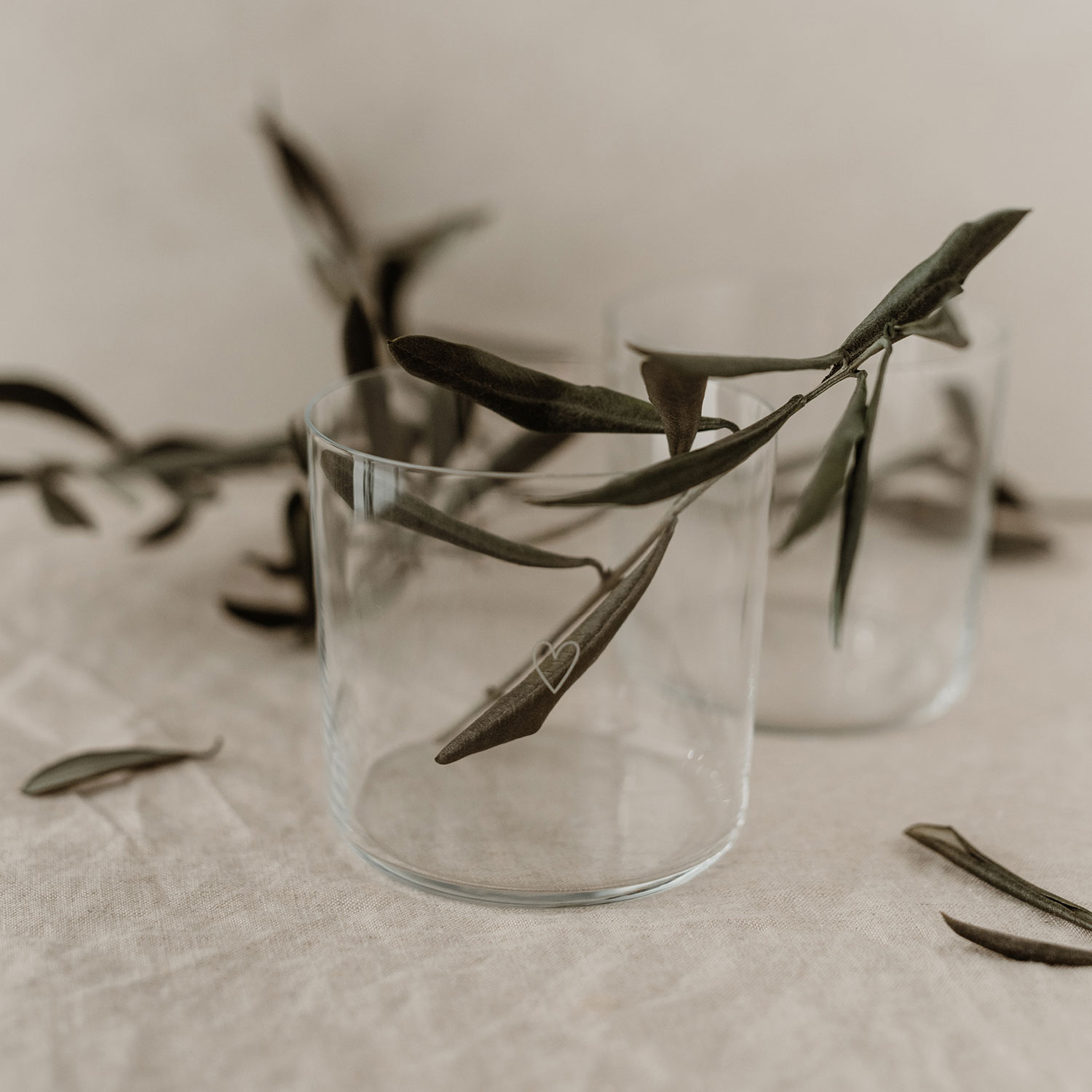 Modern Heart Print Glass Set | 350ml | Set of 2 | Stackable Design Transform your table setting with these elegant thin-walled drinking glasses. Each glass in this set of two features a delicate white heart print and unique owl base engraving. Despite their lightweight design, these 350ml glasses are surprisingly durable and conveniently stackable. Perfect for everything from water and cocktails to desserts and snacks. Dishwasher safe and sized just right at 8.5cm height, these versatile glasses blend modern style with everyday practicality.