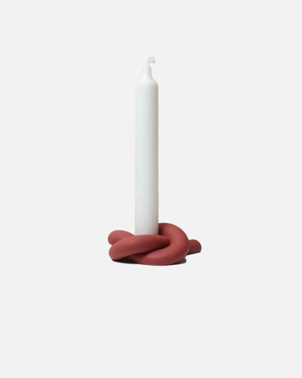 Concrete knot-shaped candlestick holder in red colour