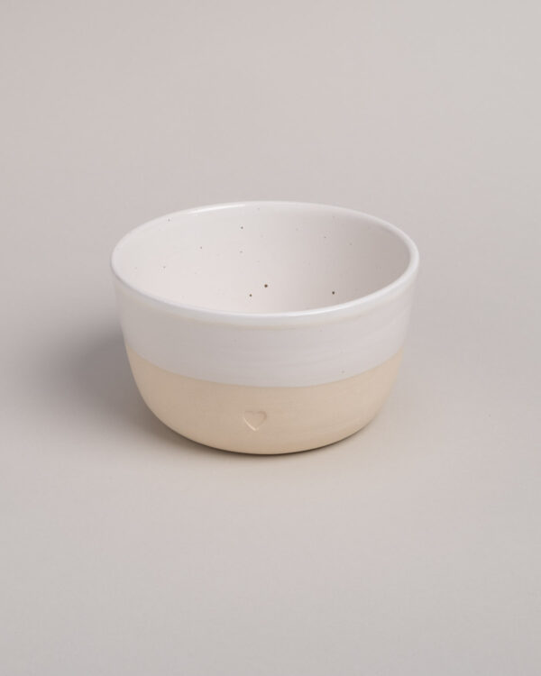 a bowl with a blind embossing in the shape of a heart.