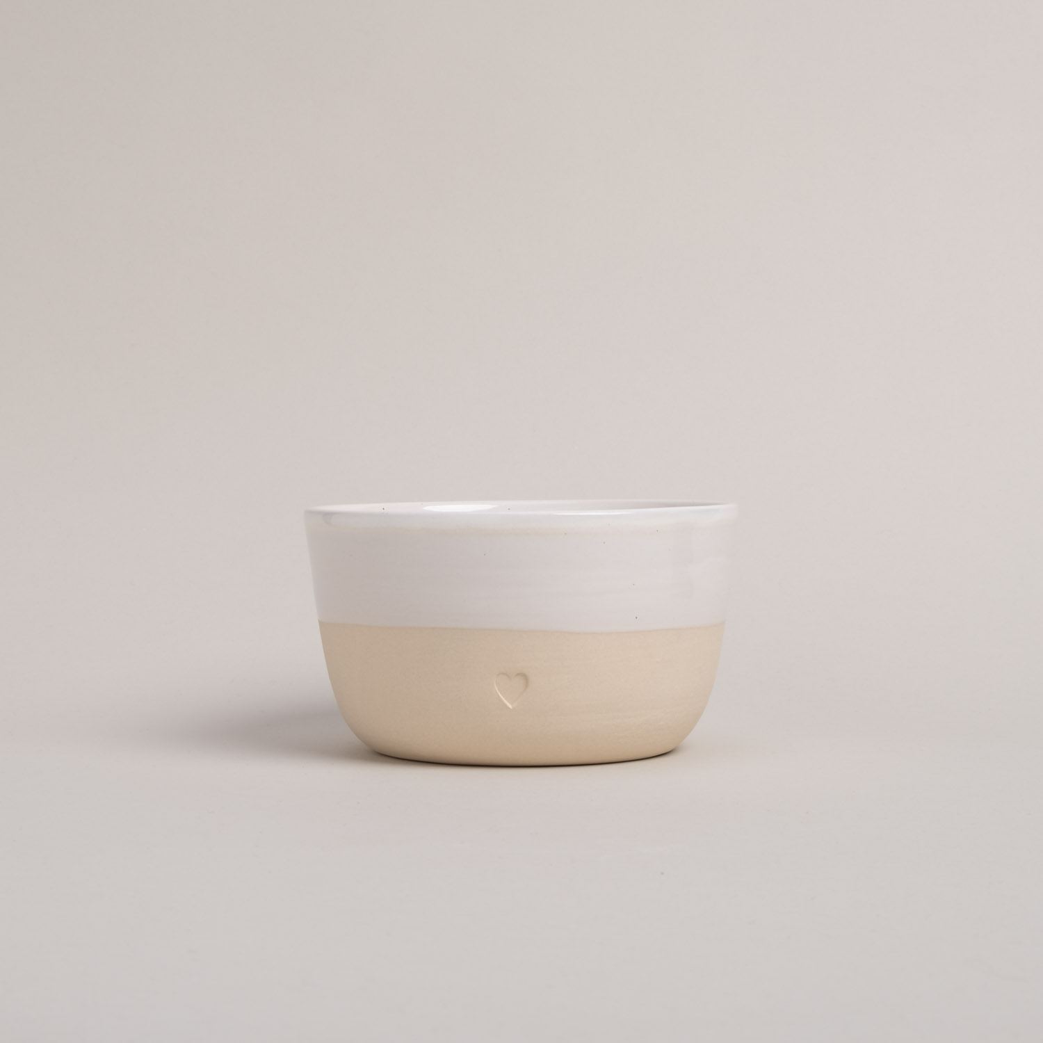 a bowl with a blind embossing in the shape of a heart.