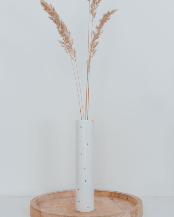 Elevate your home decor with our stunning golden dots vase, a perfect blend of elegance and simplicity. Crafted with a sleek cylinder design, this vase is adorned with exquisite gold dots created from real gold print, adding a touch of luxury to any space.