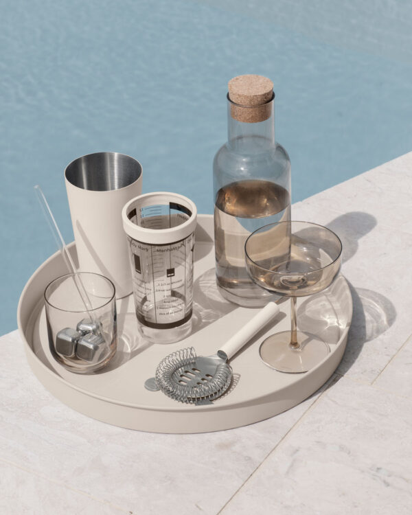 beige tray in a outdoors setting by the pool