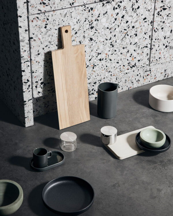 terrazzo kitchen featuring a cutting board with other uttensils