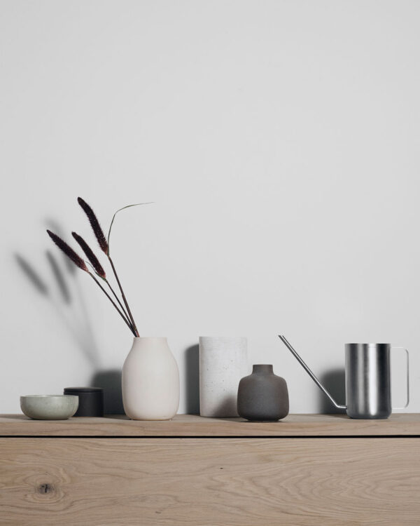 watering can on a shelf