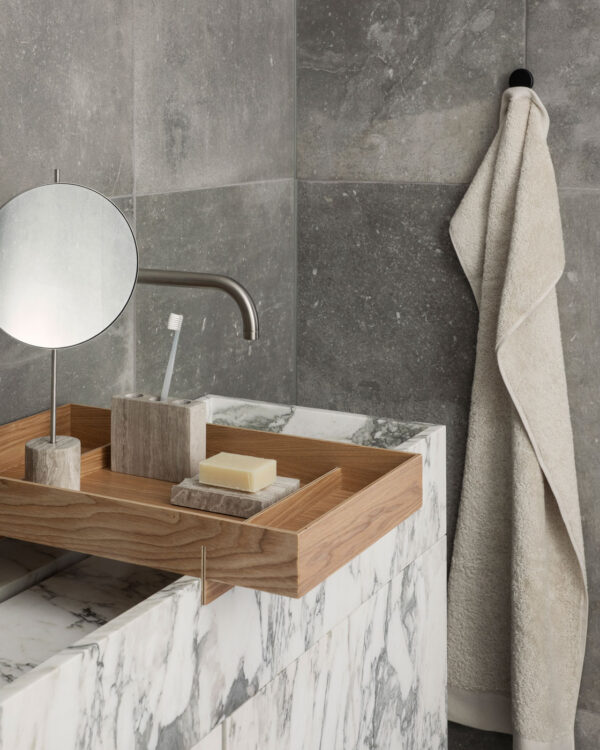 a bento tray with a toothbrush holder and and soap holder on the bathroom sink