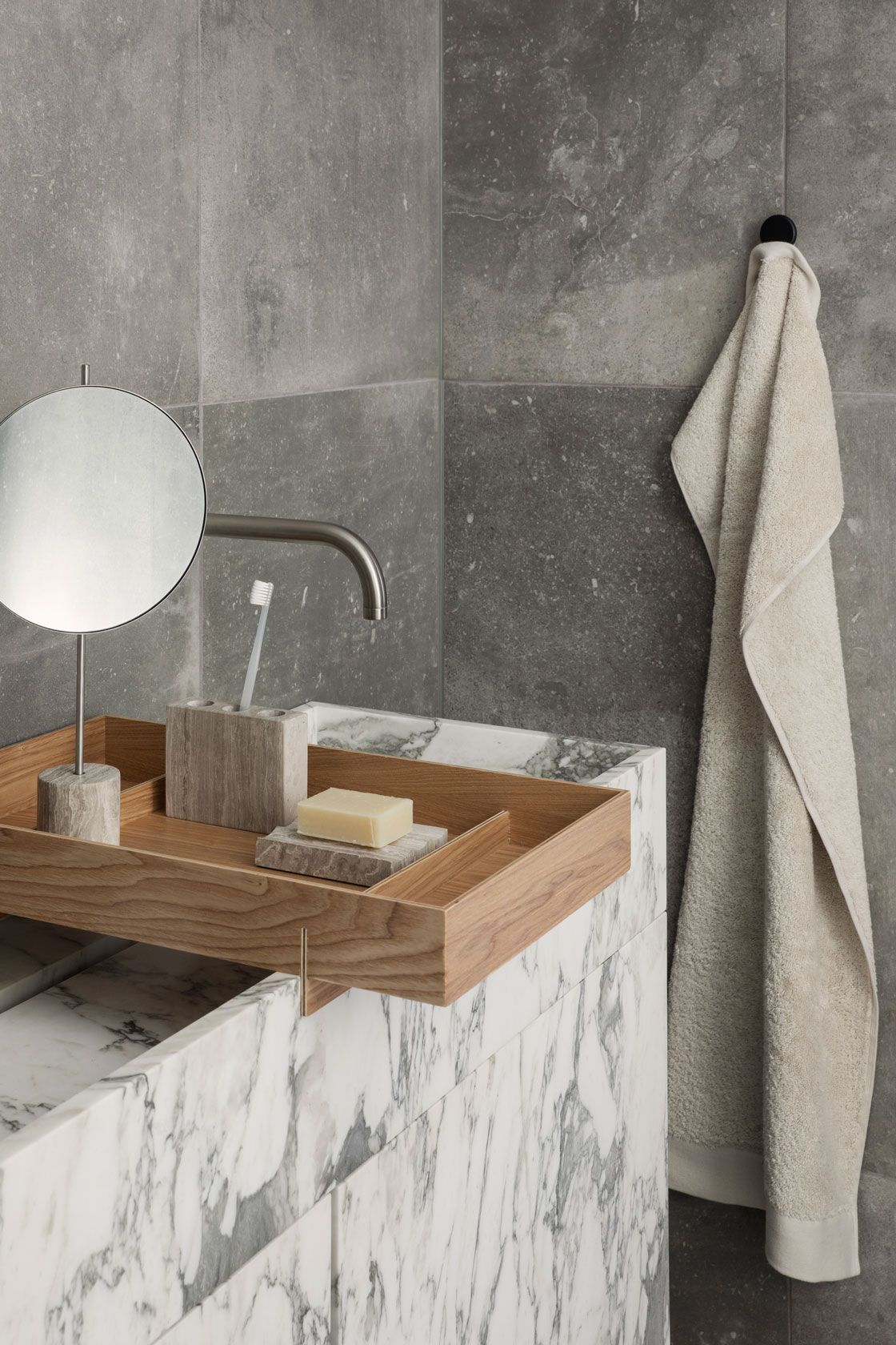 a bento tray with a toothbrush holder and and soap holder on the bathroom sink