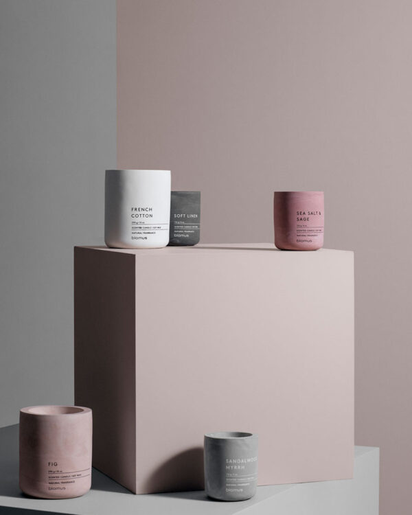 scented candles in a concrete container on cubes in various sizes