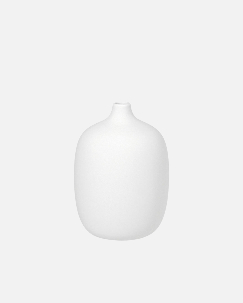 Discover the rustic beauty of the Ceola vase series by Frederike Martens. Handmade by local artisans, each vase in soft white brings a unique, natural feel to your interior.