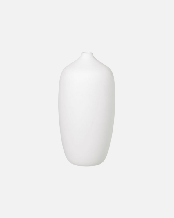 Discover the rustic beauty of the Ceola vase series by Frederike Martens. Handmade by local artisans, each vase in soft white brings a unique, natural feel to your interior.