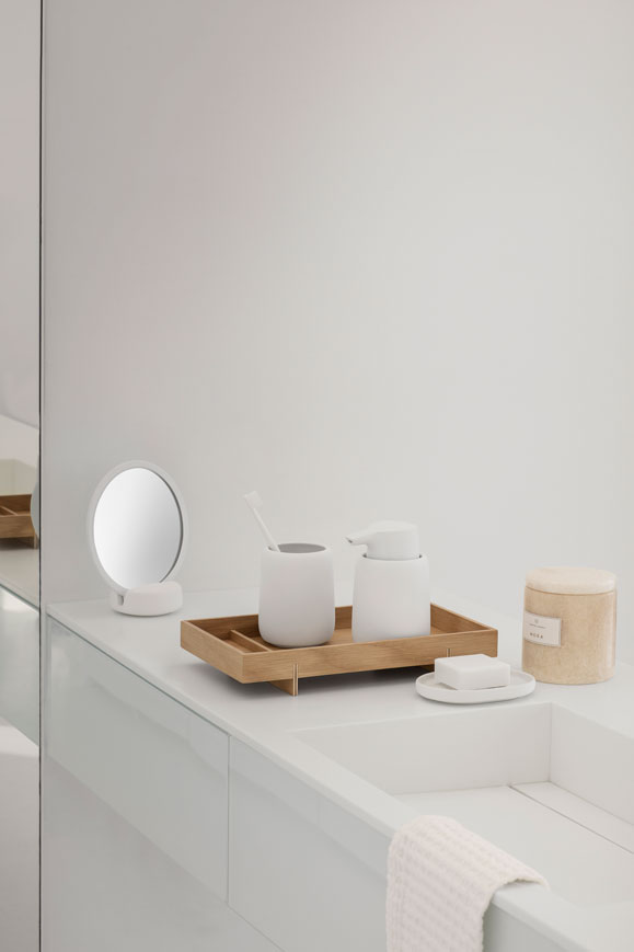a light grey toothbrush holder for web on a worktop