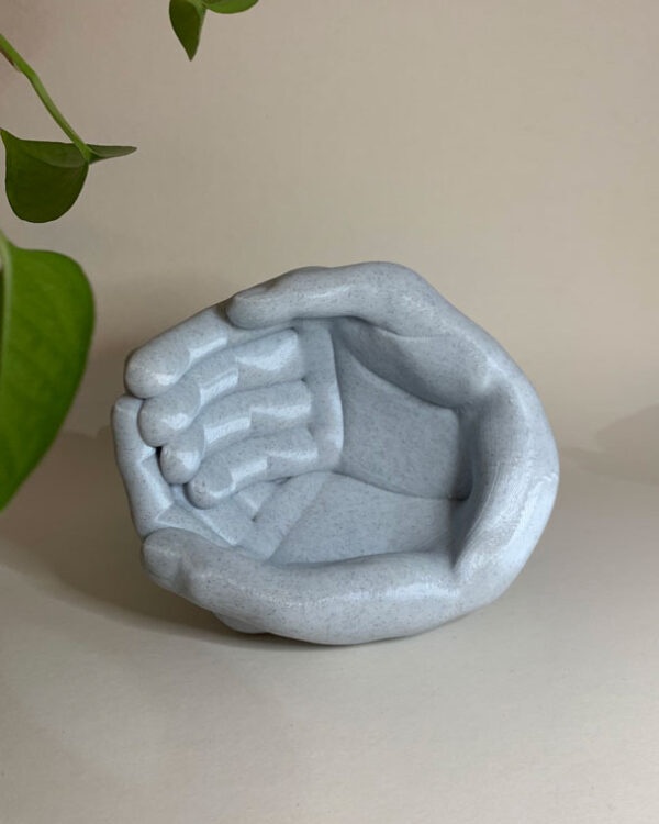 planter in the shape of hands in marble shade