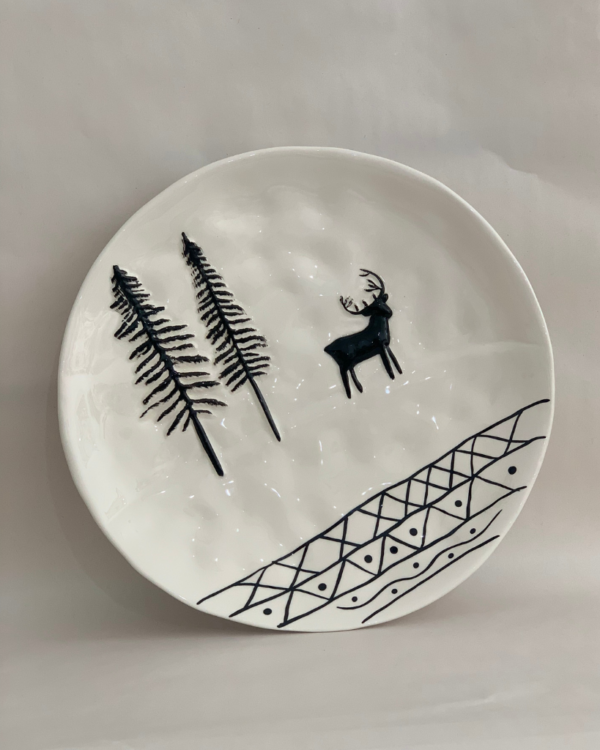 christmas plate with fir trees and a reindeer