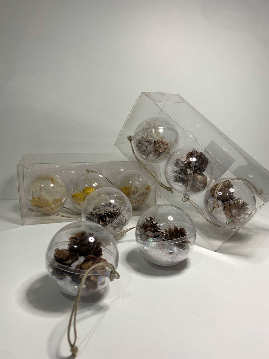 Set of 3 clear plastic baubles filled with dried pine branches and pampas grass, perfect for adding a rustic touch to holiday decorations.