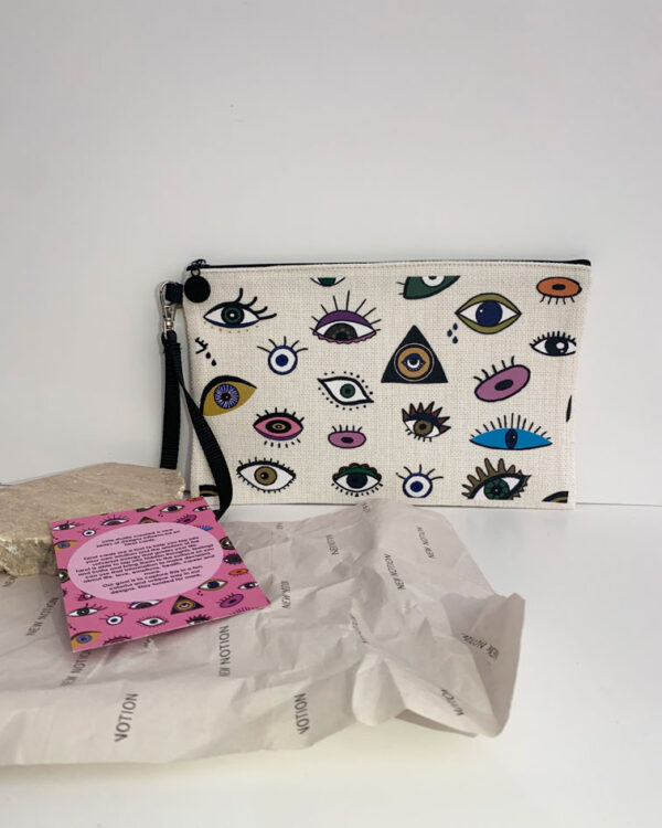 pouch with a design influenced by tarot cards. full of eyes in different colours and designs