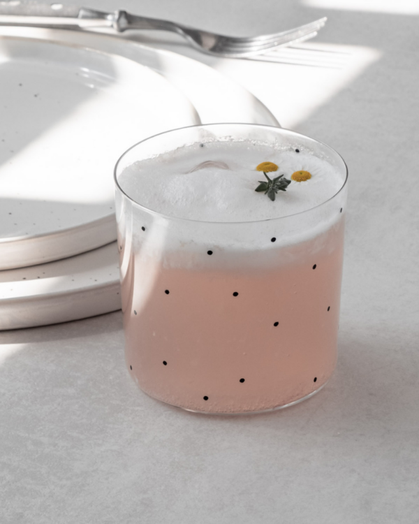 This set of two drinking glasses is a stylish and sophisticated choice. The sleek design, accented with chic black dots, adds a touch of elegance to any home. Made from high-quality materials and dishwasher safe, these versatile glasses are as practical as they are beautiful. Packaged in a stylish gift box, ready for giving.