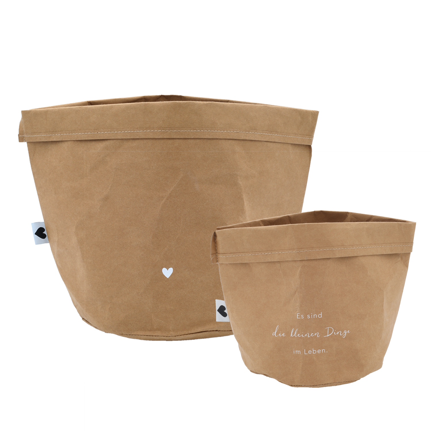 paper baskets in black colour. This set consists of two paper bags in different sizes. The larger paperbag is decorated with a heart. The smaller one bears the saying "It's the little things in life" in German.