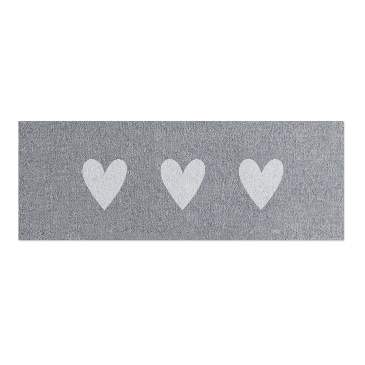 a grey doormat with 3 white hearts on it. 75cm x 25cm.
