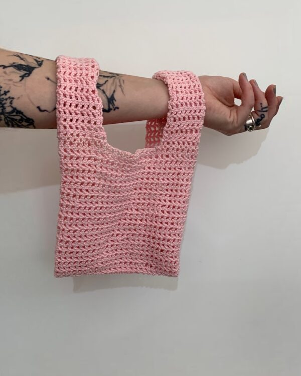 crochet bag in pink colour.