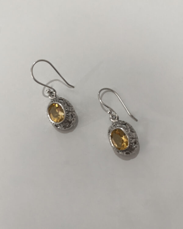 sterling silver earrings with a citrine stone on a white background