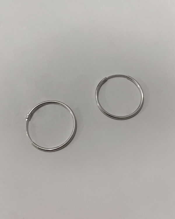 sterling silver hoop earrings on a white background
