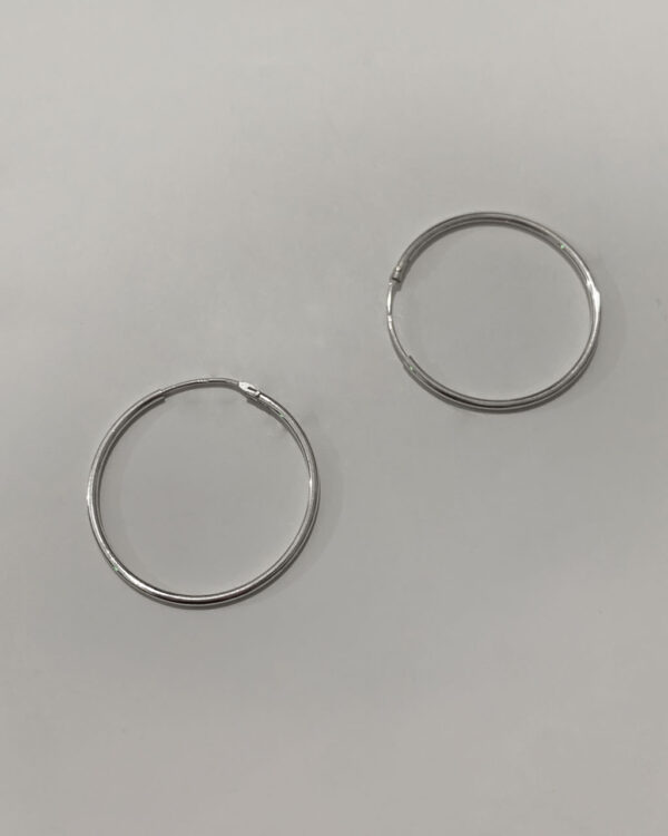 sterling silver hoop earrings on a white background