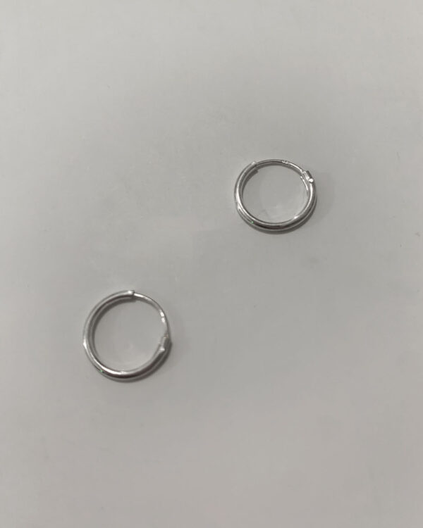 sterling silver hoop earrings on a white background