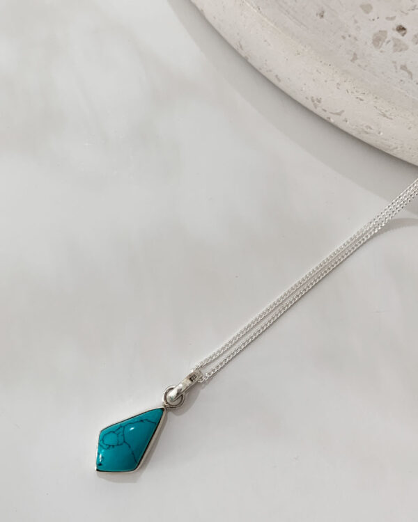 turquoise stone necklace on a white background