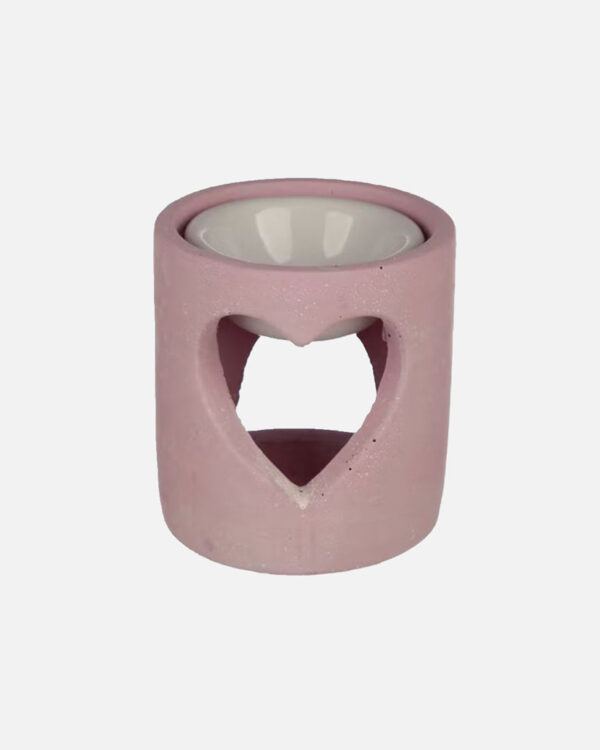 pink concrete wax burner with a heart-shaped cut out. Crafted with care to create a soothing and inviting atmosphere.