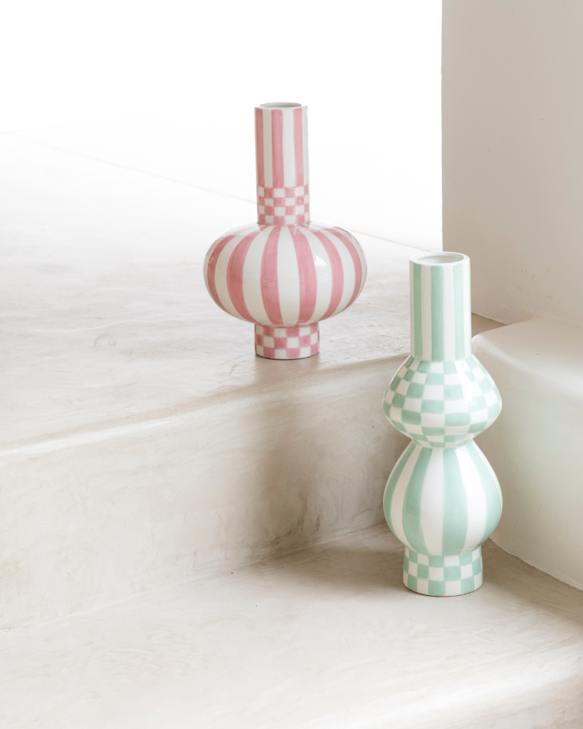 Discover the ceramic Gabriela vase from Qué Rico - a vibrant addition to your home decor. Hand-painted with a Squares & Stripes pattern, this Belgian-designed vase is a unique and colorful gift option.
