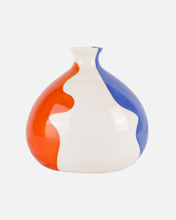 Discover the beauty of the Bruno vase from Qué Rico and enhance your floral displays with style. This hand-painted ceramic vase, inspired by the vibrant Spanish culture, features the eye-catching Melting Magic pattern in orange and blue hues. Its unique design and craftsmanship make it a versatile decor piece that adds warmth and character to any living space.