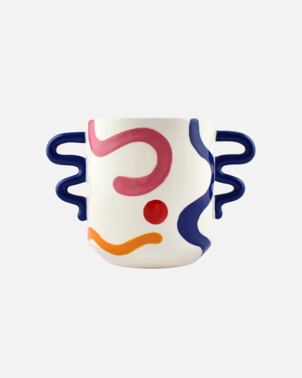 Add a vibrant twist to your plants with the ceramic Eva plant pot from Qué Rico. Designed in Belgium and infused with Spanish inspiration, this planter, adorned with the Pintura Locura pattern, is the perfect home for your leafy friends. With its organic shape and funky colour combination of blue, red, yellow and pink, this handcrafted planter is a true eye-catcher in any interior. As it is hand-painted, every piece is unique! Gift packaging included.