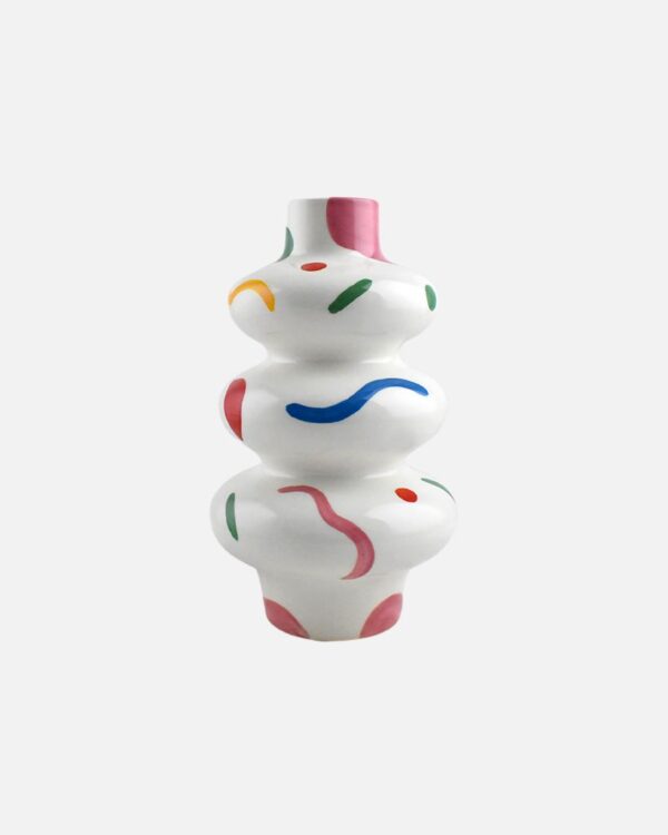 Bring a pop of color and personality to your space with the Elena vase from Qué Rico. Designed in Belgium, this handmade vase showcases the lively Confetti Party pattern, making it a standout piece in any room.