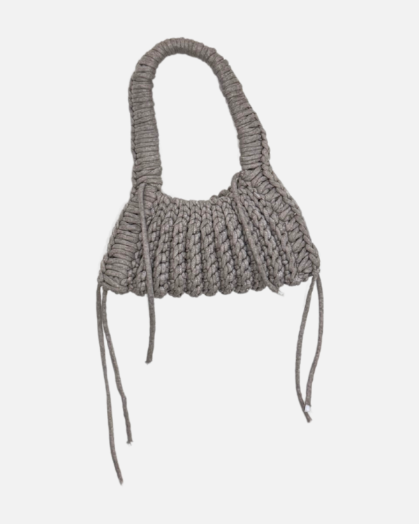 This handcrafted ash bag combines style and function with its chunky crochet texture. Made from soft t-shirt yarn, it easily transitions from shoulder to handbag, making it the perfect companion from day to night. Features a stretchy yet sturdy construction that adapts to your needs.