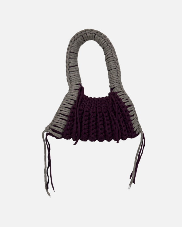 This handcrafted ash / maroon bag combines style and function with its chunky crochet texture. Made from soft t-shirt yarn, it easily transitions from shoulder to handbag, making it the perfect companion from day to night. Features a stretchy yet sturdy construction that adapts to your needs.