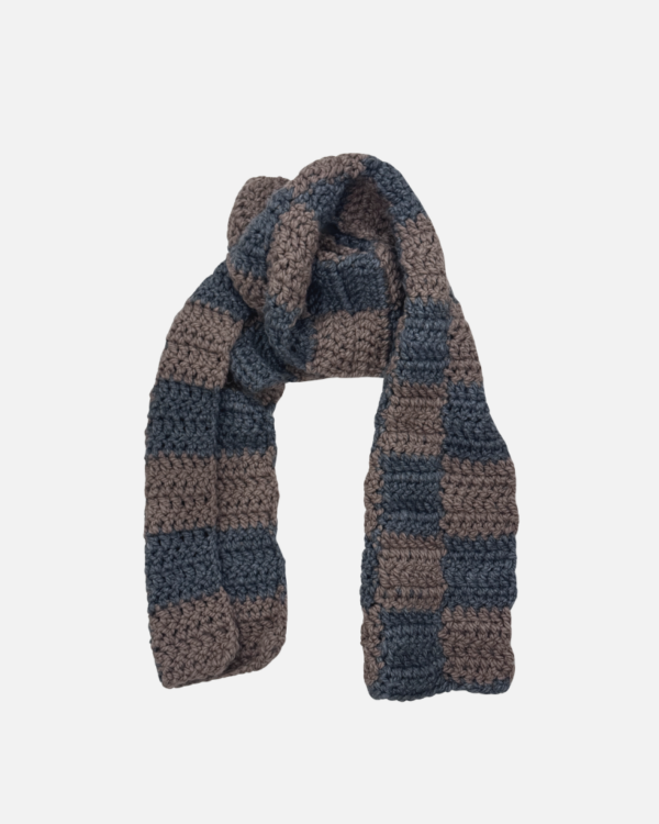 Close-up of a handmade grey and beige checkered crochet scarf by new notion