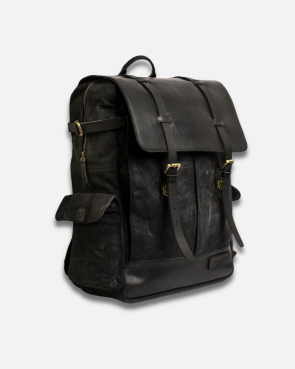 Meet the Rambler: a handcrafted 24L backpack that combines heavy-duty 14oz waxed canvas with premium crunch leather. Built for both daily commutes and motorcycle adventures, it features four quick-access pockets, water-resistant construction with double-waxed canvas, and a protective rain cover. The reinforced back panel ensures comfort whether you're wearing it or mounting it on your motorcycle. Perfect for everything from everyday carry to weekend getaways.