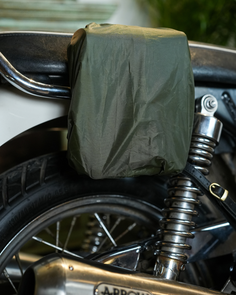 Premium leather sling bag with quick-release mounting (motorcycle compatible), one-click opening, and included rain cover. Handcrafted and built to last, developing a unique patina over time. Perfect for everyday carry and more.