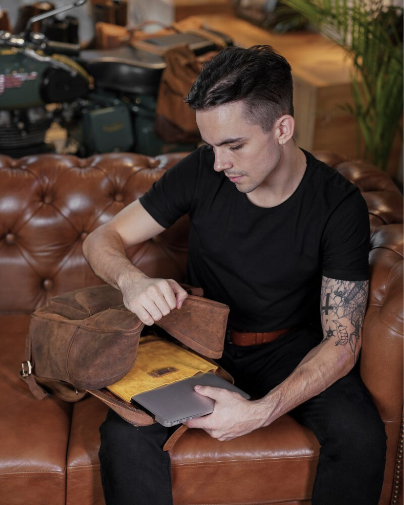 eastwood | backpack use it as a saddlebag or tail bag 2.2 mm thick heavy duty leather that's forged to last hard waxed leather that builds its own patina over time detachable suede laptop sleeve and 2 internal bottle holders quick access rain cover
