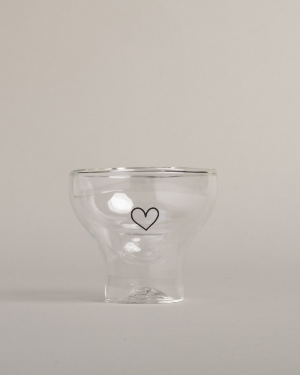 Serve in style with our double-walled heart glass. This elegant 100ml glass features temperature-maintaining design, perfect for cocktails and desserts. Dishwasher safe and heat-resistant for versatile entertaining.
