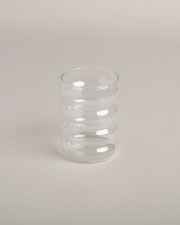 Modern Bubble Glass with unique 4-ring shape. 300ml capacity, dishwasher safe. Perfect for water, juice & entertaining. Comfortable ergonomic design.