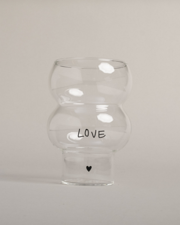 Celebrate love with our Double Bubble glass featuring elegant "Love" lettering and heart detail. This 450ml glass combines style with sentiment, perfect for special occasions or adding romance to everyday moments. Standing elegantly at 12.8cm tall with an 8.9cm width, it's perfectly sized for everything from refreshing cocktails to creative desserts. Dishwasher safe.