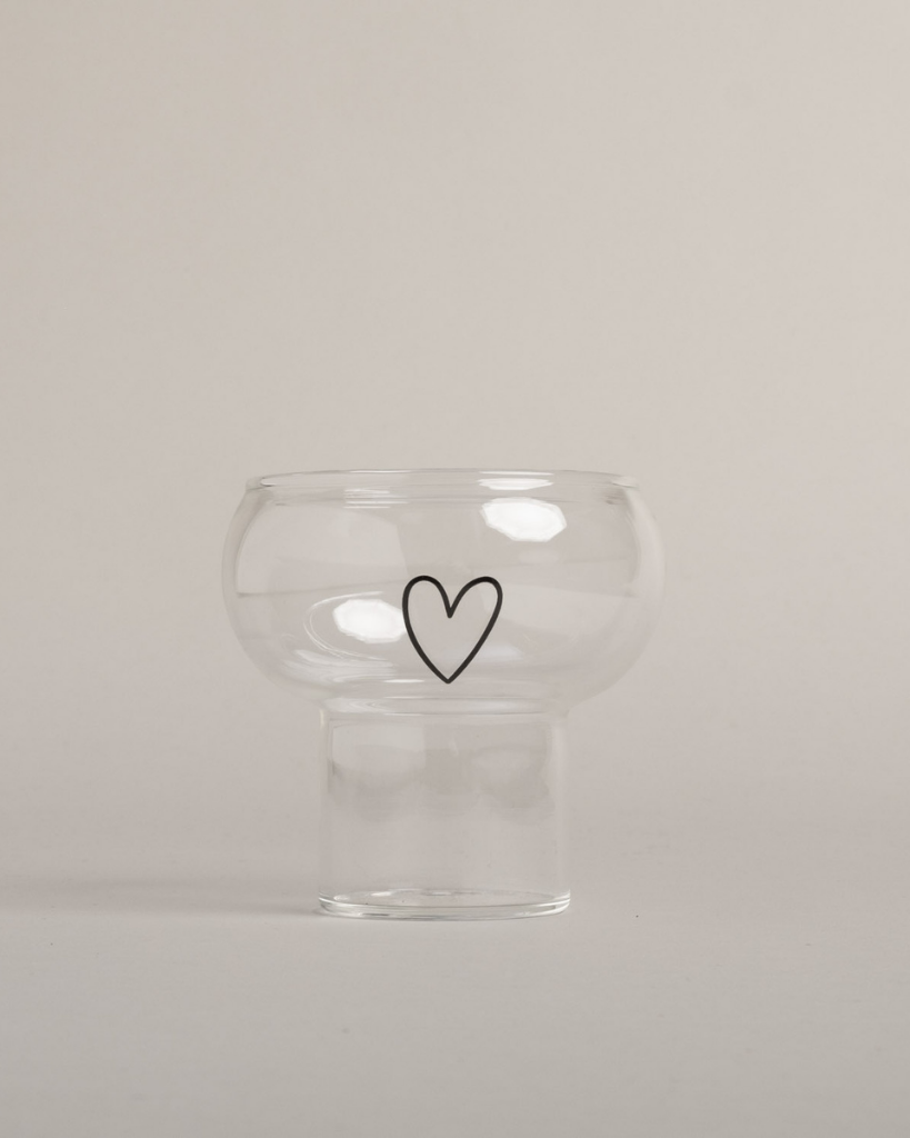 Make every drink special with the trendy Bubble Glass Heart. This unique glass features a playful spherical shape and charming heart detail, perfect for cocktails, iced coffee, or any beverage. Stylish, functional, and dishwasher safe.