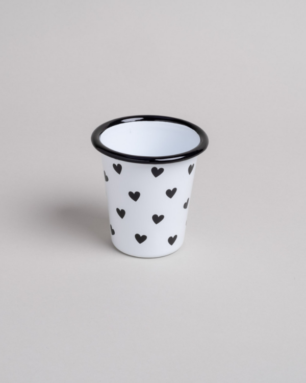 Heart Pattern Enamel Camping Mug | 290ml | Outdoor & Camping Essential Add joy to your outdoor adventures with this charming enamel mug featuring delicate black hearts. Built tough for camping and picnics, this 290ml mug combines vintage style with modern durability. Dishwasher safe and easy to clean, it's perfect for hot drinks around the campfire or backyard gatherings. The sturdy enamel construction ensures long-lasting use while its compact size (9cm x 8.6cm) makes it ideal for camping kits and outdoor dining.