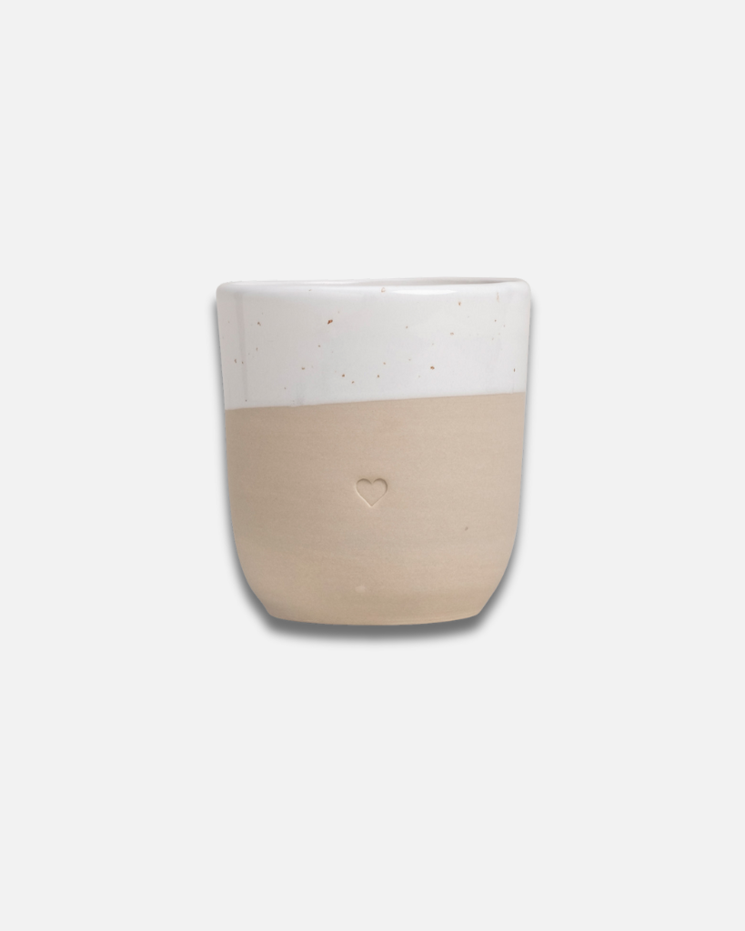 Discover the charm of handmade pottery with our exclusive stoneware heart mug. Each 320ml mug is carefully crafted in a small Portuguese pottery, featuring a beautiful embossed heart design. Every piece is unique, showcasing subtle variations in glaze and texture that make it truly special. Combining practicality with artisanal beauty, these dishwasher-safe mugs measure 8.5-9cm in height, perfect for your daily coffee or tea ritual.