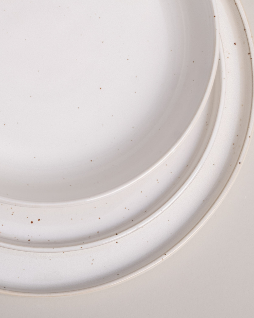 Elevate your dining experience with our handcrafted Calma dinner plate. Each 27cm plate features natural glaze variations and improved stackable design. Perfectly sized for main courses, this dishwasher-safe plate combines artisanal beauty with modern practicality.